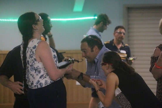 A photograph of teachers and Heads of Departments using drones