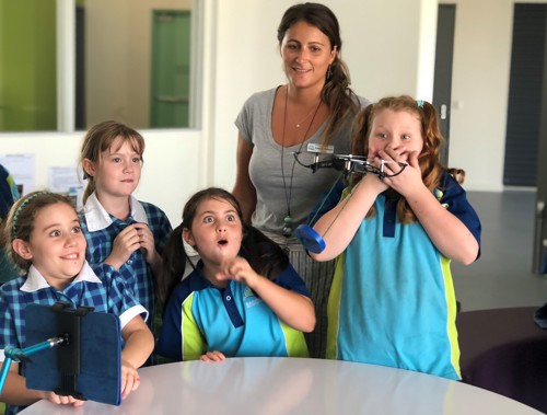 Image of Teacher with four students